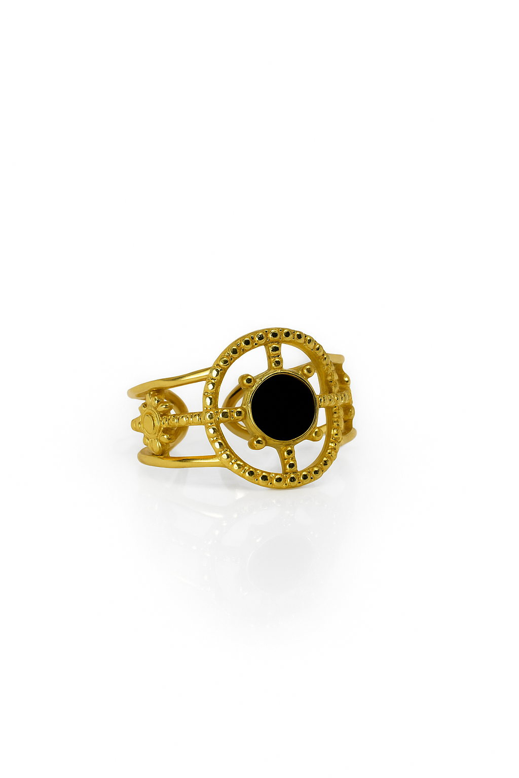 Gold compass statement ring with black onyx stone and ornate detailing on white background