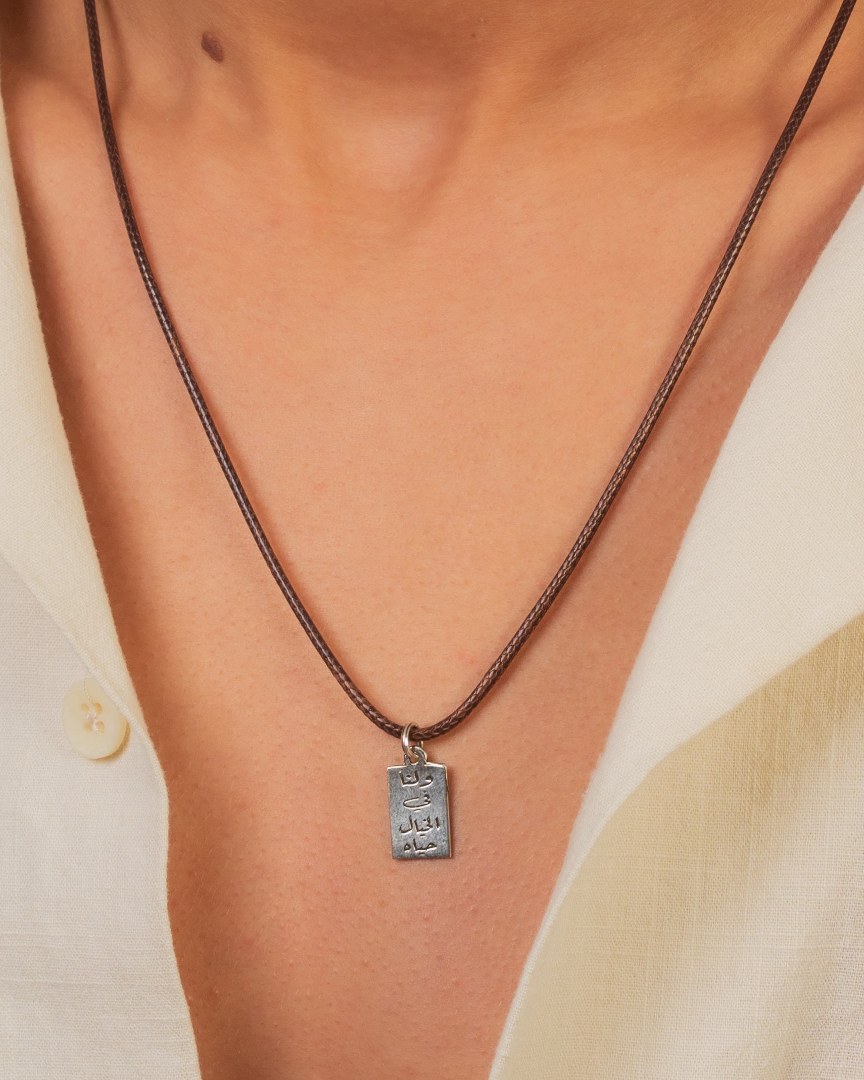 Scripted Leather Medallion Silver Necklace