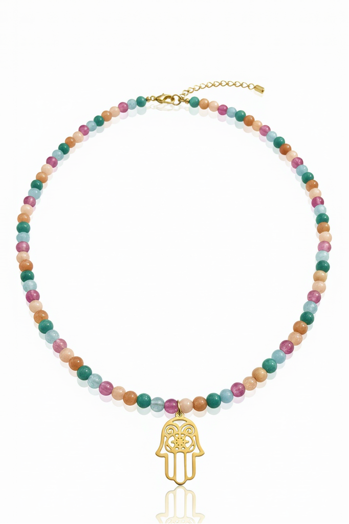 Multicolored beaded necklace with a gold Hamsa hand charm on a white background
